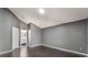 Bedroom features hardwood floors, natural light, and an en-suite bathroom at 13169 Odyssey Lake Way, Orlando, FL 32826