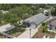 Charming single Gathering home featuring mature landscaping, large driveway, and attached garage at 13169 Odyssey Lake Way, Orlando, FL 32826