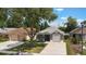 Charming single-story home with a well-maintained lawn and a driveway at 13169 Odyssey Lake Way, Orlando, FL 32826