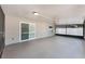 A spacious screened patio featuring concrete floors and overhead lighting at 13169 Odyssey Lake Way, Orlando, FL 32826