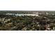 Scenic aerial view of Lake of the Woods community surrounded by mature trees at 136 Teriwood Ct, Fern Park, FL 32730