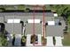Aerial view of the townhome units, including rooftops, driveways, and lawn, highlighted by red outline at 136 Teriwood Ct, Fern Park, FL 32730