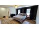 Bright bedroom with a ceiling fan, wood-look floors, and large windows at 136 Teriwood Ct, Fern Park, FL 32730