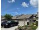 Inviting townhome with a well-kept yard, garage, and a charming American flag adding curb appeal at 136 Teriwood Ct, Fern Park, FL 32730