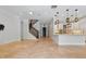 Inviting foyer with staircase, tile floors, leading to an open-concept kitchen and living area at 1361 Palmer Ave., Winter Park, FL 32789