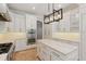Gourmet kitchen with marble counters, large island, stainless steel appliances, and custom cabinetry at 1361 Palmer Ave., Winter Park, FL 32789