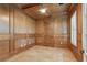 Private office with wood-paneled walls and ceiling, and a large window with plantation shutters at 1361 Palmer Ave., Winter Park, FL 32789