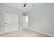Bedroom featuring carpet floors, closet and neutral walls and trim at 14208 Shocklach Dr, Winter Garden, FL 34787