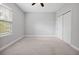Bedroom with carpeted floors, a window with blinds, and a closet with sliding doors at 14208 Shocklach Dr, Winter Garden, FL 34787
