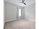 Neutral bedroom with carpet, ceiling fan, window with curtains, and base trim at 14208 Shocklach Dr, Winter Garden, FL 34787