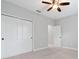 Bedroom featuring carpet, a closet with sliding doors, and a ceiling fan at 14208 Shocklach Dr, Winter Garden, FL 34787