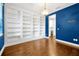 Elegant dining room featuring built-in bookshelves with view of Butler's Pantry at 14208 Shocklach Dr, Winter Garden, FL 34787