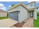 Exterior of a well maintained two-car garage at 14208 Shocklach Dr, Winter Garden, FL 34787