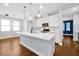 Modern kitchen with stainless steel appliances, center island, and quartz countertops at 14208 Shocklach Dr, Winter Garden, FL 34787