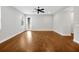 Spacious living room with hardwood floors, a ceiling fan, and a glass patio door for easy outdoor access at 14208 Shocklach Dr, Winter Garden, FL 34787