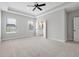 Spacious main bedroom featuring a ceiling fan and dual windows for natural light at 14208 Shocklach Dr, Winter Garden, FL 34787