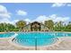 Community pool with zero entry, lounge chairs and covered pavilion for entertaining at 14208 Shocklach Dr, Winter Garden, FL 34787