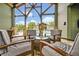 Comfortable lounge seating in the covered pavilion overlooking the community pool at 14208 Shocklach Dr, Winter Garden, FL 34787