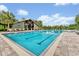 Inviting community pool featuring lap lanes, an open-air pavilion, and poolside lounge chairs at 14208 Shocklach Dr, Winter Garden, FL 34787