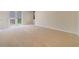Bedroom featuring carpet, neutral paint, and double doors to balcony at 14516 Sunbridge Cir, Winter Garden, FL 34787