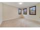 Empty bedroom with large windows, plush carpeting and wood shutters at 14516 Sunbridge Cir, Winter Garden, FL 34787