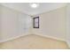 Bright bedroom features neutral carpet, light walls, a window with blinds and a closet with double doors at 14516 Sunbridge Cir, Winter Garden, FL 34787