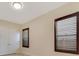 Bedroom with plantation shutters and neutral paint tones at 14516 Sunbridge Cir, Winter Garden, FL 34787