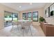 Charming breakfast nook with a round table, stylish chairs, and views of the landscaped backyard at 14516 Sunbridge Cir, Winter Garden, FL 34787