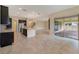 Spacious open floor plan combines kitchen, island, stainless appliances, with dining and living areas at 14516 Sunbridge Cir, Winter Garden, FL 34787