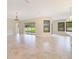 Open floor plan showcases tile flooring, lots of natural light, and access to the backyard and patio at 14516 Sunbridge Cir, Winter Garden, FL 34787