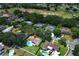 Aerial view of a home with a pool, landscaping and a golf course in the background at 1529 Ensenada Dr, Orlando, FL 32825