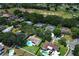 Aerial view showing a residential neighborhood and golf course in the distance at 1529 Ensenada Dr, Orlando, FL 32825