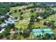 A bird's eye view of the Rio Pinar Golf & Country Club, featuring tennis courts and beautifully landscaped grounds at 1529 Ensenada Dr, Orlando, FL 32825