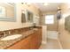 Well-appointed bathroom features double sinks, granite countertop, and tiled shower/tub combo at 1529 Ensenada Dr, Orlando, FL 32825