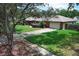Attractive home with a two-car garage, landscaped yard, and inviting curb appeal at 1529 Ensenada Dr, Orlando, FL 32825