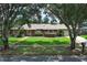 Beautiful home with a well-kept lawn, shrubbery, and a welcoming entrance at 1529 Ensenada Dr, Orlando, FL 32825