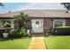 Inviting front entrance of a brick home with decorative plants and a glass front door with sidelights at 1529 Ensenada Dr, Orlando, FL 32825