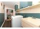 Functional laundry room with modern washer, utility sink, and ample storage space at 1529 Ensenada Dr, Orlando, FL 32825