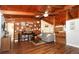Comfortable living room featuring wood floors, wood beams and a collection of records at 1529 Ensenada Dr, Orlando, FL 32825