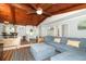 Bright living room with comfortable seating, wood-paneled ceiling, and seamless flow into the dining area at 1529 Ensenada Dr, Orlando, FL 32825
