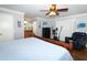Comfortable primary bedroom with ceiling fan, and sitting area with exercise equipment at 1529 Ensenada Dr, Orlando, FL 32825