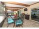 Enclosed outdoor patio dining area features a grill and views of the pool at 1529 Ensenada Dr, Orlando, FL 32825