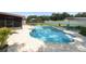 Backyard features an in-ground swimming pool, brick patio, and well-maintained landscaping at 1529 Ensenada Dr, Orlando, FL 32825