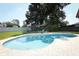 Beautiful backyard pool surrounded by brick pavers and lush landscaping, perfect for relaxation and entertainment at 1529 Ensenada Dr, Orlando, FL 32825
