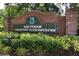 A brick sign marks the entrance to Rio Pinar Country Club Estates, surrounded by lush foliage at 1529 Ensenada Dr, Orlando, FL 32825