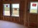 Future bright bedroom featuring multiple windows and pre-wired electrical outlets during construction at 15447 Hamlin Park Drive, Winter Garden, FL 34787
