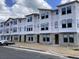 New townhomes under construction with windows installed and some of the exterior finish applied at 15447 Hamlin Park Drive, Winter Garden, FL 34787