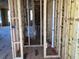 Framed hallway highlighting the building's construction with exposed studs and visible fixtures at 15447 Hamlin Park Drive, Winter Garden, FL 34787