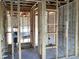 Interior view of new construction featuring framed walls, wiring and plumbing at 15447 Hamlin Park Drive, Winter Garden, FL 34787