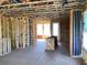 Interior view of new construction featuring framed walls, wiring, plumbing and windows at 15447 Hamlin Park Drive, Winter Garden, FL 34787